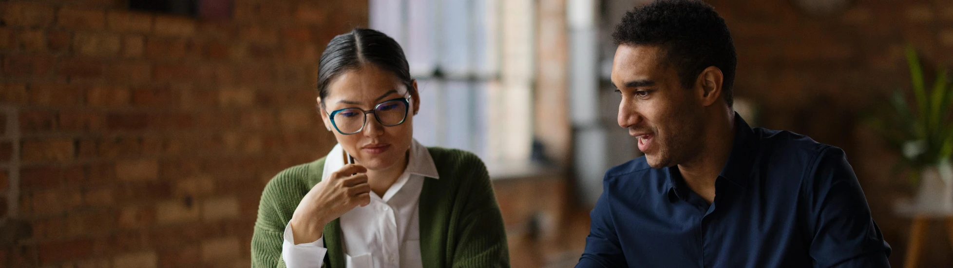man and woman discussing credit risk